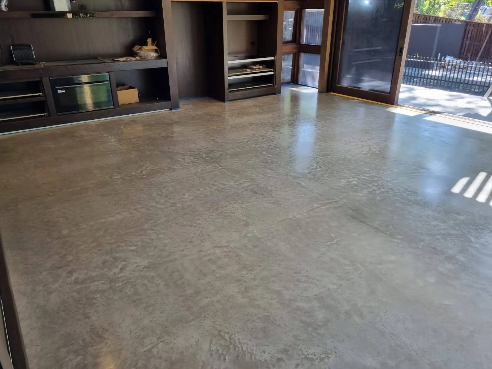 Polished concrete floor in a modern open-plan kitchen