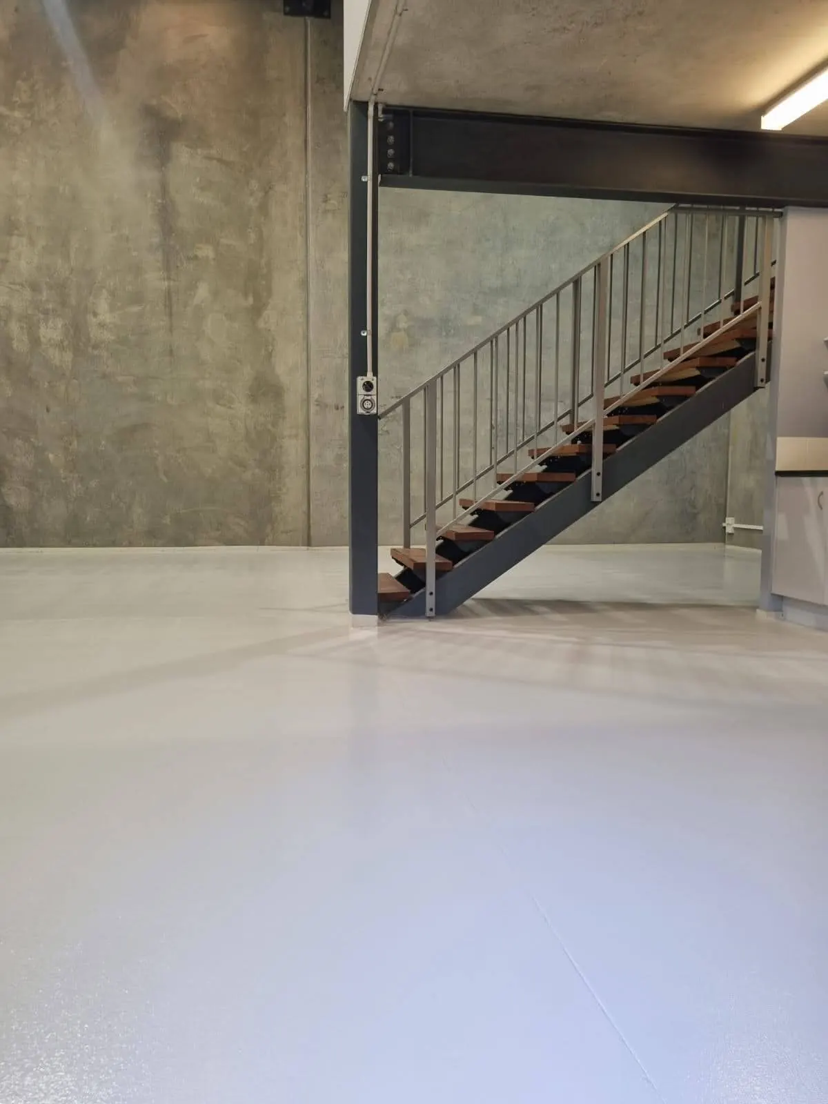 Industrial polished concrete floor and matching stair treads