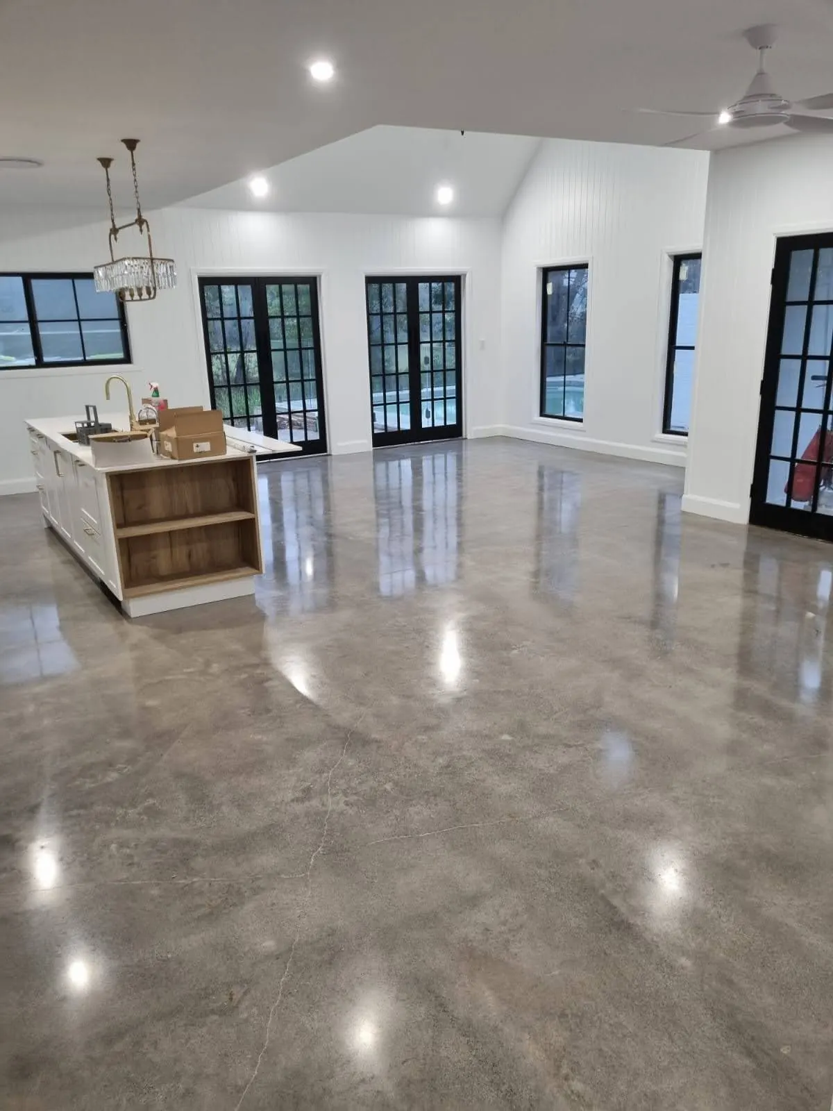 Polished concrete through a modern kitchen and living area