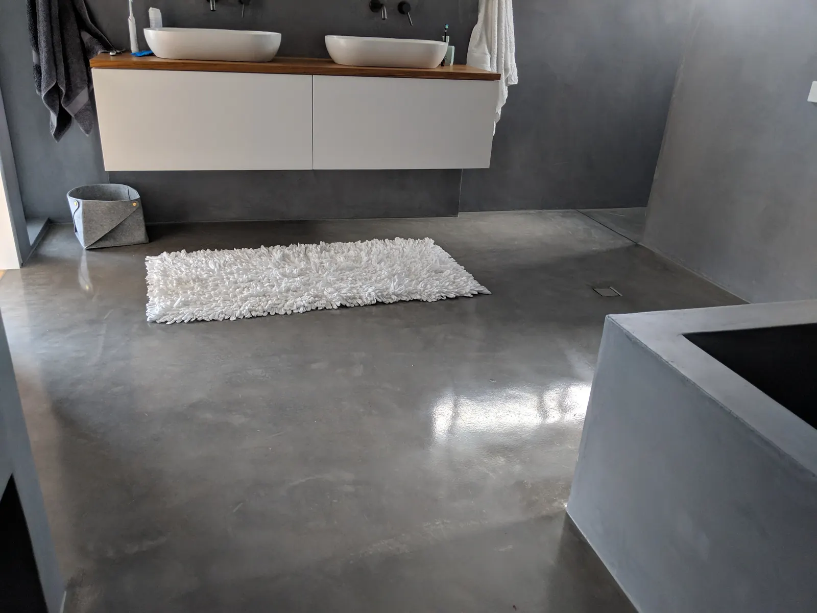 Polished concrete floor in a modern bathroom