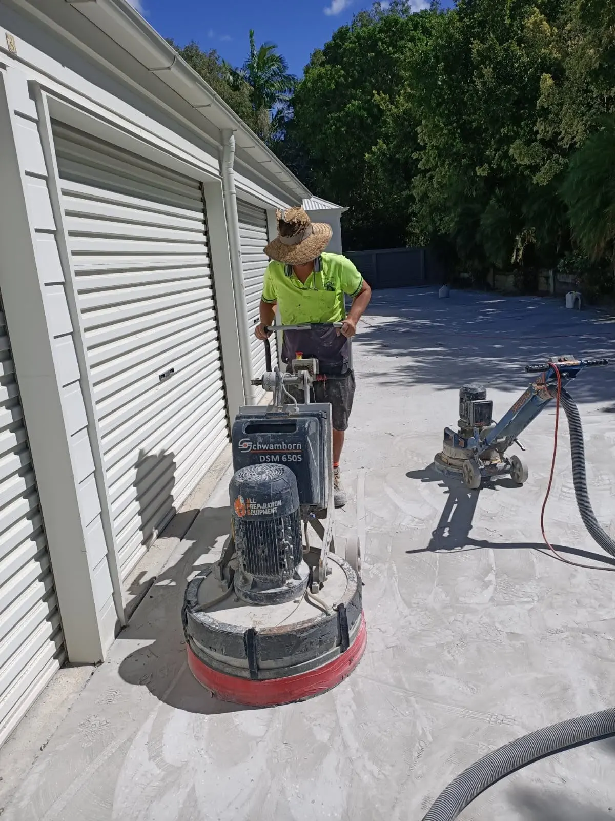 Diamond grinding and preparing a concrete slab before coating