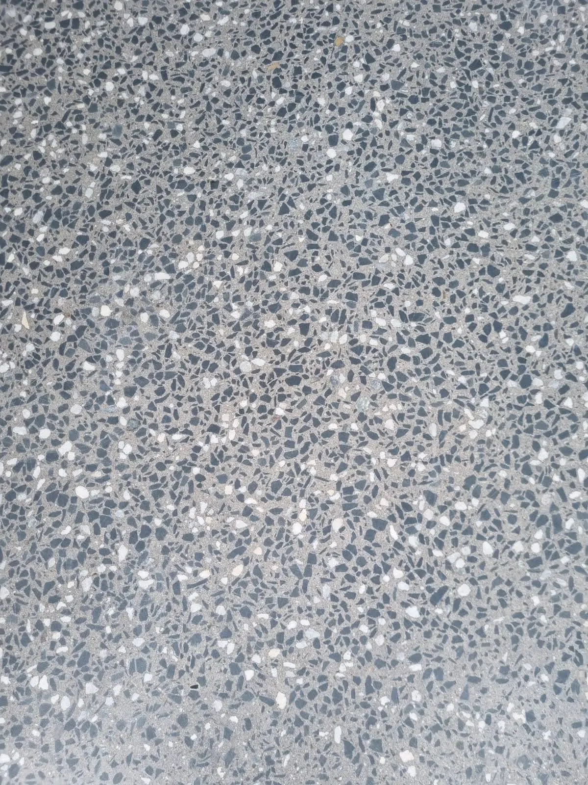 Close-up of an exposed aggregate concrete floor finish