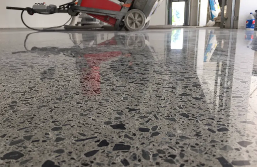 Polished concrete floor treated with a lithium silicate densifier
