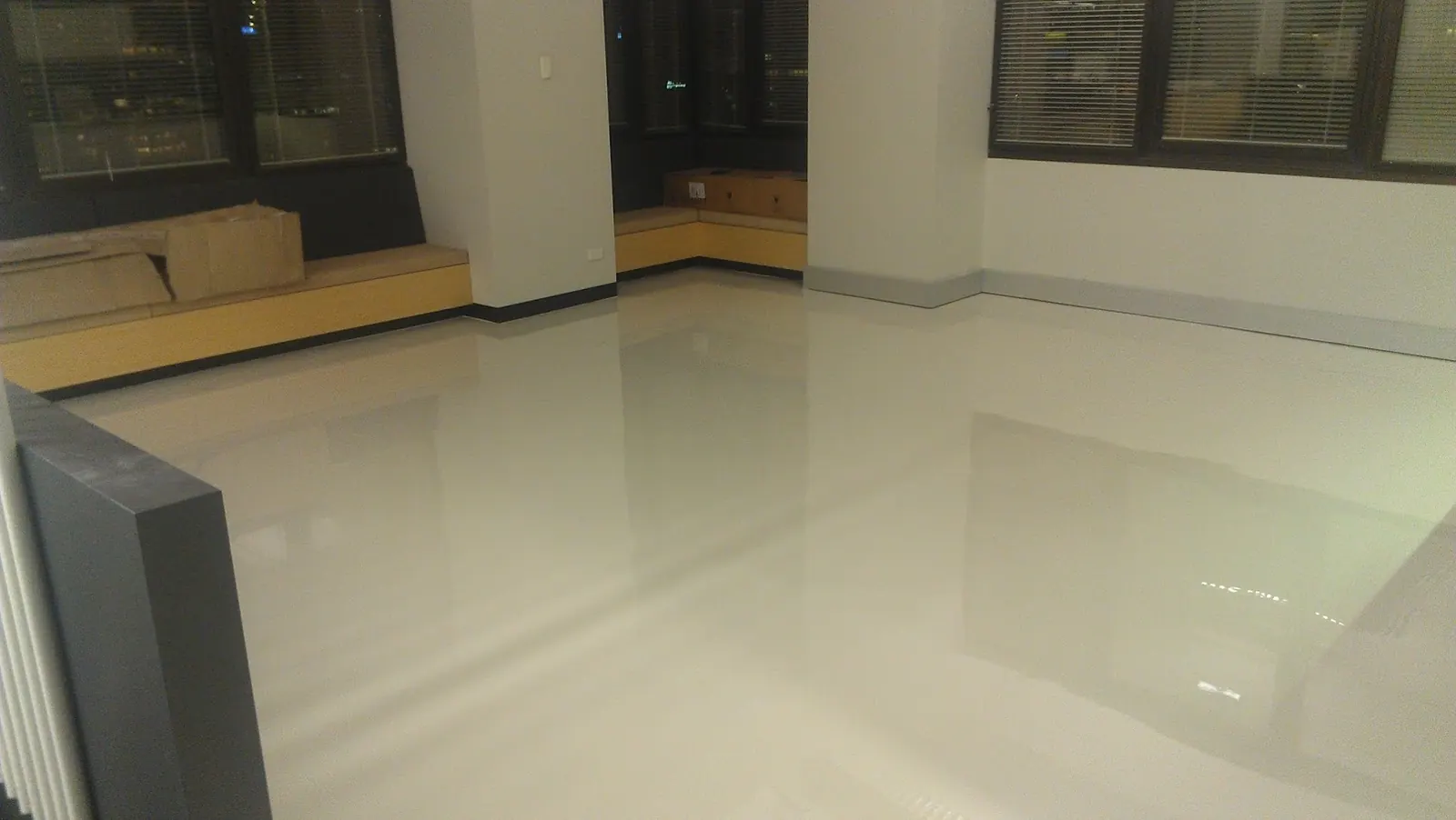 Cream polished concrete floor in a commercial showroom